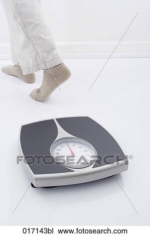 detail of person walking away from scales View Large Photo Image Stock Image - detail of person walking away from scales. Fotosearch