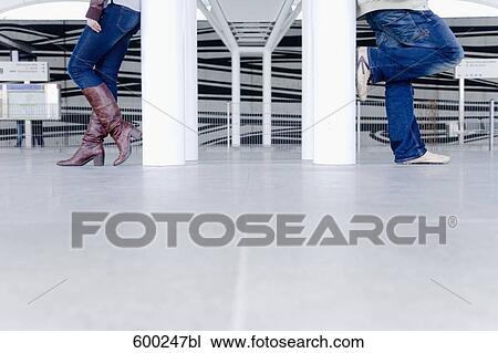 detail of teenage girl and boy standing back to back leaning against pillars View Large Photo Image Stock Image - detail of teenage girl and boy standing back to back leaning against pillars. Fotosearch