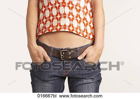 detail of young woman putting hands in pockets of her jeans View Large Photo Image Stock Image - detail of young woman putting hands in pockets of her jeans. Fotosearch