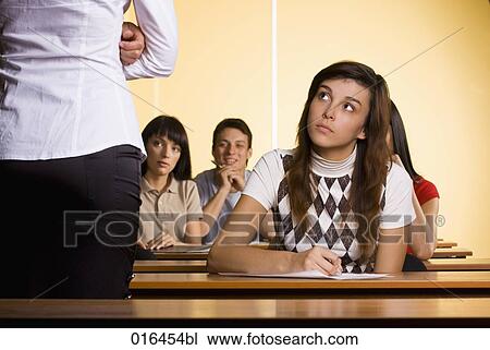 female student listening to teacher during school seminar View Large Photo Image Stock Image - female student listening to teacher during school seminar. Fotosearch