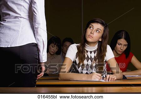 female student listening to teacher during school seminar View Large Photo Image Stock Image - female student listening to teacher during school seminar. Fotosearch