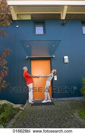 full body portrait of mature couple dancing at front door of their home View Large Photo Image Stock Image - full body portrait of mature couple dancing at front door of their home. Fotosearch