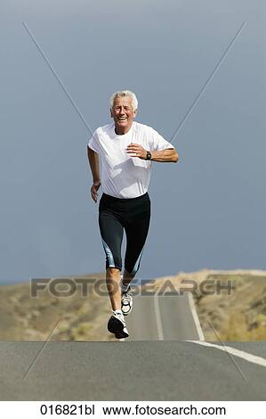full body portrait of mature man jogging along empty road View Large Photo Image Stock Image - full body portrait of mature man jogging along empty road. Fotosearch