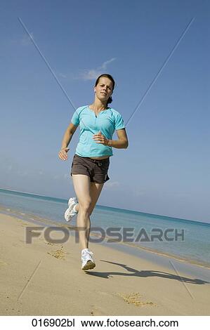 full body portrait of young woman jogging on beach View Large Photo Image Stock Image - full body portrait of young woman jogging on beach. Fotosearch
