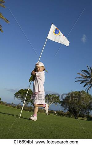 full boy portrait of little girl holding flag on golf course View Large Photo Image Stock Image - full boy portrait of little girl holding flag on golf course. Fotosearch