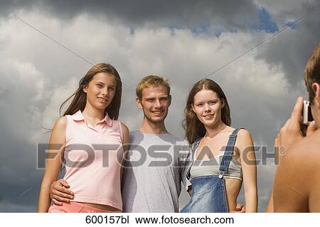 group of three friends posing for a portrait View Large Photo Image Stock Image - group of three friends posing for a portrait. Fotosearch