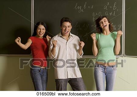 group of three students celebrating in front of blackboard View Large Photo Image Stock Image - group of three students celebrating in front of blackboard. Fotosearch