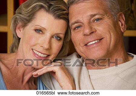 Stock Image - headshot of mature couple at home. Fotosearch