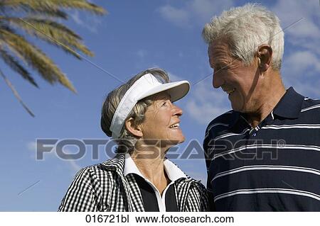headshot of mature couple looking at each other View Large Photo Image Stock Image - headshot of mature couple looking at each other. Fotosearch