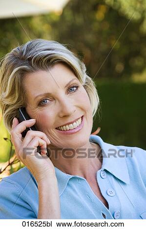 headshot of mature woman talking on mobile phone View Large Photo Image Stock Image - headshot of mature woman talking on mobile phone. Fotosearch