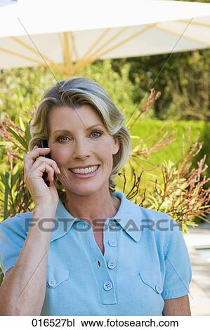 headshot of mature woman talking on mobile phone View Large Photo Image Stock Image - headshot of mature woman talking on mobile phone. Fotosearch