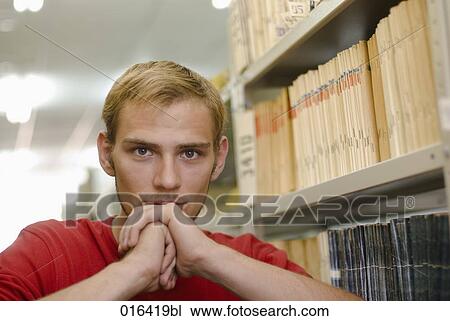 headshot of pensive male student in school library View Large Photo Image Stock Image - headshot of pensive male student in school library. Fotosearch