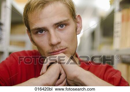 headshot of pensive male student in school library View Large Photo Image Stock Image - headshot of pensive male student in school library. Fotosearch
