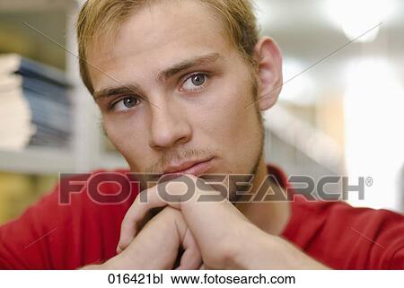 headshot of pensive male student in school library View Large Photo Image Stock Image - headshot of pensive male student in school library. Fotosearch