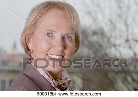 headshot of smiling mature woman View Large Photo Image Stock Image - headshot of smiling mature woman. Fotosearch