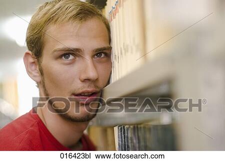 headshot of stressed out male student in school library View Large Photo Image Stock Image - headshot of stressed out male student in school library. Fotosearch