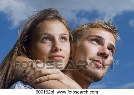 headshot of teenage girl embracing her boyfriend View Large Photo Image Stock Image - headshot of teenage girl embracing her boyfriend. Fotosearch