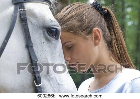 headshot of teenage girl with white horse View Large Photo Image Stock Image - headshot of teenage girl with white horse. Fotosearch