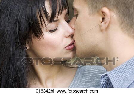 headshot of young couple kissing View Large Photo Image Stock Image - headshot of young couple kissing. Fotosearch