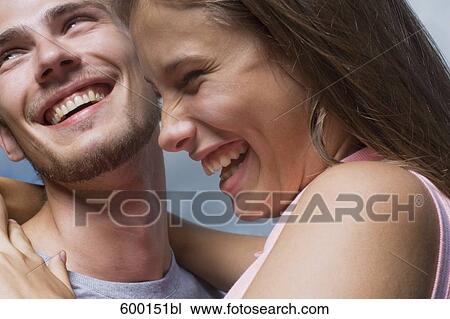 headshot of young couple sharing a laugh View Large Photo Image Stock Image - headshot of young couple sharing a laugh. Fotosearch