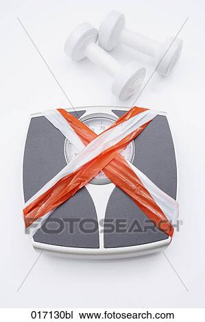 high angle view of of dumb bells and scales covered with barrier tape View Large Photo Image Stock Image - high angle view of of dumb bells and scales covered with barrier tape. Fotosearch