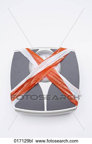 high angle view of scales covered with barrier tape View Large Photo Image Stock Image - high angle view of scales covered with barrier tape. Fotosearch