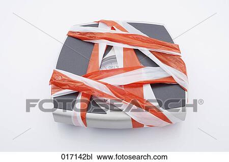 high angle view of scales covered with barrier tape View Large Photo Image Stock Image - high angle view of scales covered with barrier tape. Fotosearch
