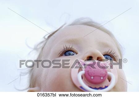 low angle portrait of baby with pacifier View Large Photo Image Stock Image - low angle portrait of baby with pacifier. Fotosearch