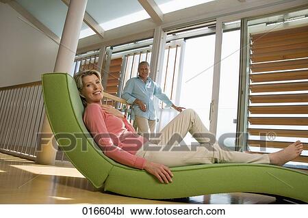 mature couple in living at home woman lying on chair View Large Photo Image Stock Image - mature couple in living at home woman lying on chair. Fotosearch