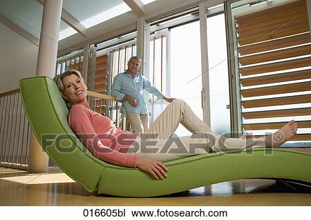 mature couple in living at home woman lying on chair View Large Photo Image Stock Image - mature couple in living at home woman lying on chair. Fotosearch