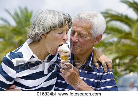 mature man feeding woman ice cream View Large Photo Image Stock Image - mature man feeding woman ice cream. Fotosearch