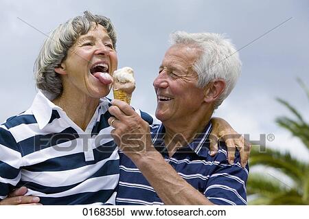 mature man feeding woman ice cream View Large Photo Image Stock Image - mature man feeding woman ice cream. Fotosearch