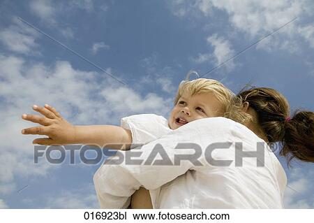 mother hugging her young son View Large Photo Image Stock Image - mother hugging her young son. Fotosearch