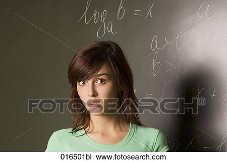 portrait of confused female student in front of blackboard View Large Photo Image Stock Image - portrait of confused female student in front of blackboard. Fotosearch