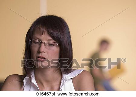Stock Image - portrait of female student wearing glasses. Fotosearch