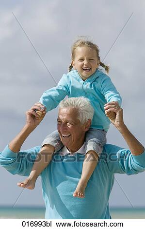 portrait of grandfather carrying young girl piggyback View Large Photo Image Stock Image - portrait of grandfather carrying young girl piggyback. Fotosearch