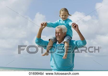 portrait of grandfather carrying young girl piggyback View Large Photo Image Stock Image - portrait of grandfather carrying young girl piggyback. Fotosearch