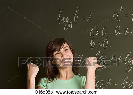 portrait of happy female student in front of blackboard View Large Photo Image Stock Image - portrait of happy female student in front of blackboard. Fotosearch