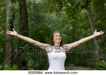 portrait of happy young woman in park View Large Photo Image Stock Image - portrait of happy young woman in park. Fotosearch