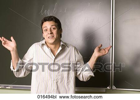 portrait of male student in front of blackboard View Large Photo Image Stock Image - portrait of male student in front of blackboard. Fotosearch