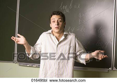 portrait of male student in front of blackboard View Large Photo Image Stock Image - portrait of male student in front of blackboard. Fotosearch