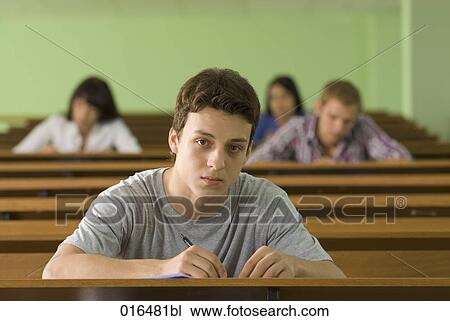 portrait of male student in lecture hall looking pensive View Large Photo Image Stock Image - portrait of male student in lecture hall looking pensive. Fotosearch