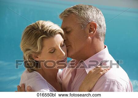portrait of mature couple kissing View Large Photo Image Stock Image - portrait of mature couple kissing. Fotosearch