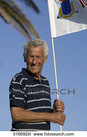 portrait of mature golf player holding flag View Large Photo Image Stock Image - portrait of mature golf player holding flag. Fotosearch