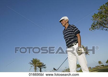 portrait of mature golf player wearing flat cap View Large Photo Image Stock Image - portrait of mature golf player wearing flat cap. Fotosearch