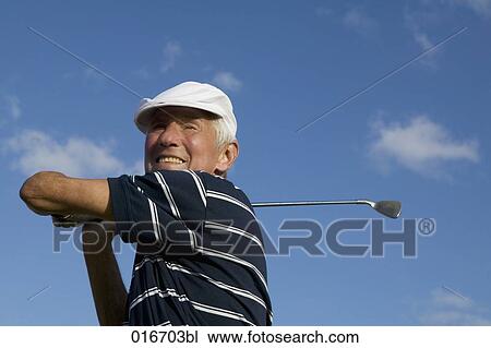 portrait of mature golf player wearing flat cap View Large Photo Image Stock Image - portrait of mature golf player wearing flat cap. Fotosearch