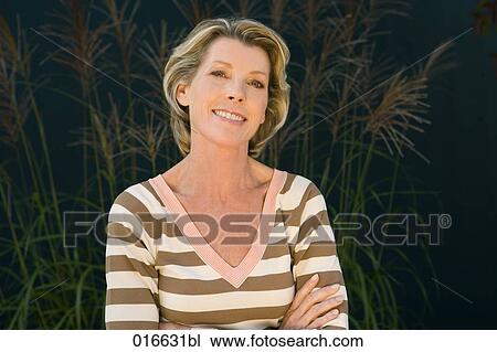 portrait of mature woman in striped jumper View Large Photo Image Stock Image - portrait of mature woman in striped jumper. Fotosearch