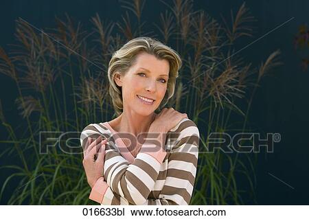 portrait of mature woman in striped jumper View Large Photo Image Stock Image - portrait of mature woman in striped jumper. Fotosearch
