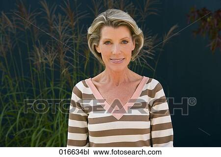 portrait of mature woman in striped jumper View Large Photo Image Stock Image - portrait of mature woman in striped jumper. Fotosearch
