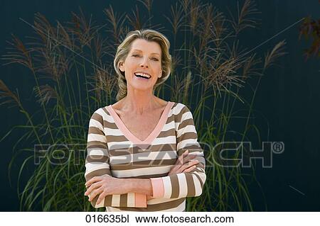 portrait of mature woman in striped jumper View Large Photo Image Stock Image - portrait of mature woman in striped jumper. Fotosearch
